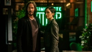 This image released by Warner Bros. Pictures shows Keanu Reeves and Carrie-Anne Moss in a scene from "The Matrix Resurrections." (Warner Bros. Pictures via AP) 