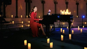 Britain's Kate, Duchess of Cambridge, performs at a Christmas carol concert at Westminster Abbey in London. Scottish singer Tom Walker praised the piano skills of the Duchess of Cambridge after the pair recorded a Christmas tune shown during a carol concert on Christmas Eve.  (Alex Bramall via AP) 