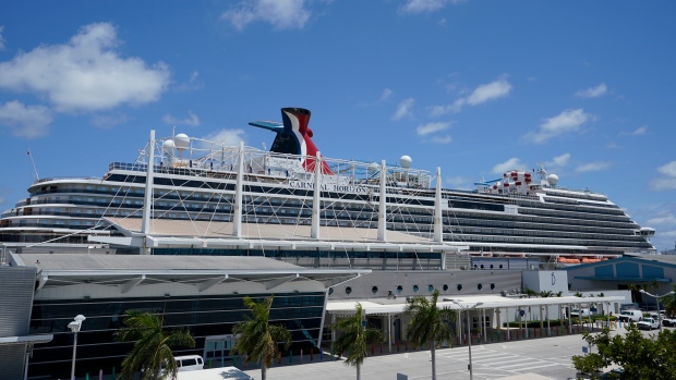 Carnival Cruise Line's Carnival Horizon cruise ship is shown docked at PortMiami, Friday, April 9, 2021, in Miami. The U.S. Centers for Disease Control and Prevention is investigating more cruise ships due to new COVID-19 cases aboard. The agency says 88 vessels are now either under investigation or observation, but it does not specify how many cases have been reported. (AP Photo/Wilfredo Lee)