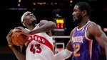 Toronto Raptors forward Pascal Siakam (43) protects the ball from Phoenix Suns centre Deandre Ayton (22) during second half NBA basketball action in Toronto on Tuesday, January 11, 2022. THE CANADIAN PRESS/Frank Gunn