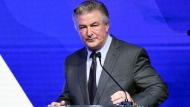 FILE - Alec Baldwin performs emcee duties at the Robert F. Kennedy Human Rights Ripple of Hope Award Gala at New York Hilton Midtown on Dec. 9, 2021, in New York. Baldwin has surrendered his cellphone as part of the investigation into a fatal shooting on a New Mexico film set last fall. A Santa Fe County Sheriffâ€™s Office spokesman says Baldwinâ€™s phone was turned over Friday, Jan. 14, 2022, to authorities in New York's Suffolk County and that information from the phone will be provided to investigators. (Photo by Evan Agostini/Invision/AP, File)