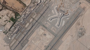In a satellite photo by Planet Labs PBC, Abu Dhabi International Airport is seen Dec. 8, 2021. A suspected drone attack by Yemen's Houthi rebels targeting a key oil facility in Abu Dhabi killed three people and sparked a separate fire at Abu Dhabi's international airport on Monday, Jan. 17, 2022, police said. (Planet Labs PBC via AP)