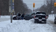 Premier Doug Ford is shown helping out a stranded motorist in Etobicoke on Monday in this photo provided by his office. (Office of the Premier)