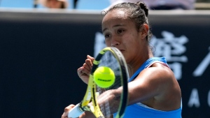 Leylah Fernandez of Canada plays a forehand return to Maddison Inglis of Australia during their first round match at the Australian Open tennis championships in Melbourne, Australia, Tuesday, Jan. 18, 2022. (AP Photo/Simon Baker)