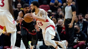 Toronto Raptors guard Fred VanVleet (23) drives to the basket as Miami Heat guard Gabe Vincent defends during the second half of an NBA basketball game, Monday, Jan. 17, 2022, in Miami. (AP Photo/Lynne Sladky)