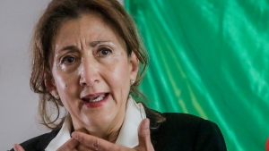 Ingrid Betacourt speaks during a press conference in Bogota, Colombia, Tuesday, Jan. 18, 2022. Betancourt, who was held as a hostage for six years by rebels of the Revolutionary Armed Forces of Colombia, FARC, announced she will be running for her country's presidency. (AP Photo/Ivan Valencia) 