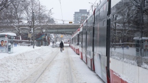 Streetcars are lined up in downtown Toronto after a three-hour delay, as a heavy snowfall affects the Greater Toronto Area, on Monday January 17, 2022. THE CANADIAN PRESS/Chris Young 
