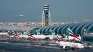 An Emirates jetliner comes in for landing at the Dubai International Airport in Dubai, United Arab Emirates, Dec. 11, 2019. (AP Photo/Jon Gambrell, File)
