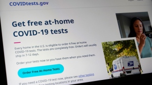 A United States government website is displayed on a computer, Wednesday, Jan. 19, 2022, in Walpole, Mass., that features a page where people can order free, at-home COVID-19 tests. The website,COVIDTests.gov, allows people to order four at-home tests per residence and have them delivered by mail. (AP Photo/Steven Senne) 