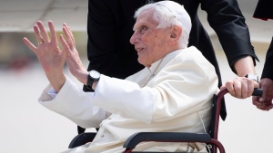 Emeritus Pope Benedict XVI waves prior of his departure at Munich Airport in Freising, Germany, June 22, 2020. Emeritus Pope Benedict XVI is returning to the Vatican after a four-day visit to Germany to visit his ailing elder brother. (Sven Hoppe/dpa via AP)