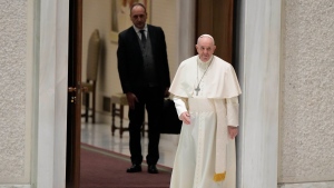 Pope Francis arrives in the Paul VI hall on the occasion of his weekly general audience at the Vatican, Wednesday, Jan. 19, 2022. (AP Photo/Andrew Medichini) 