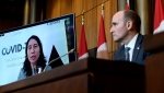 Chief Public Health Officer of Canada Dr. Theresa Tam is seen via videoconference as Minister of Health Jean-Yves Duclos looks on during a news conference on the COVID-19 pandemic and the omicron variant, in Ottawa, on Friday, Jan. 7, 2022. THE CANADIAN PRESS/Justin Tang