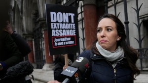 Julian Assange's partner Stella Moris, speaks outside the High Court, in London, Monday, Jan. 24, 2022. WikiLeaks founder Julian Assange has won the first stage of his effort to appeal a U.K. ruling that opened the door for his extradition to U.S. to stand trial on espionage charges. The High Court in London gave Assange permission appeal the case to the U.K. Supreme Court. (AP Photo/Alastair Grant) 