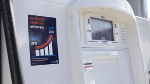 A gas pump displays an anti-carbon tax sticker in Toronto on Thursday, August 29, 2019. The Ontario government says it will not appeal a court ruling against its anti-carbon tax stickers.Energy Minister Greg Rickford's office says in a statement that the province will abide by the decision. THE CANADIAN PRESS/Chris Young