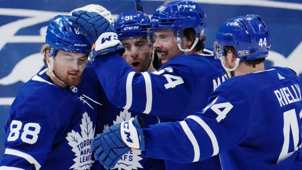 Toronto Maple Leafs' William Nylander (88) celebrates his goal against the Anaheim Ducks with teammates John Tavares (91), Auston Matthews (34) and Morgan Rielly (44) during first period NHL hockey action in Toronto on Wednesday, January 26, 2022. THE CANADIAN PRESS/Frank Gunn