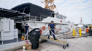 Crew members of the Coast Guard cutter William Flores get ready to go on patrol, Wednesday, Jan. 26, 2022, in Miami Beach, Fla.  (AP Photo/Marta Lavandier) 