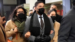 FILE - Actor Jussie Smollett, center, leaves the Leighton Criminal Courthouse with unidentified siblings, Thursday, Dec. 9, 2021, in Chicago, following a verdict in his trial. Smollett, who was found guilty last month of lying to police about a hate crime that authorities said he staged, will return to court for sentencing on March 10, a judge announced on Thursday, Jan. 27, 2022 (AP Photo/Nam Y. Huh, File)