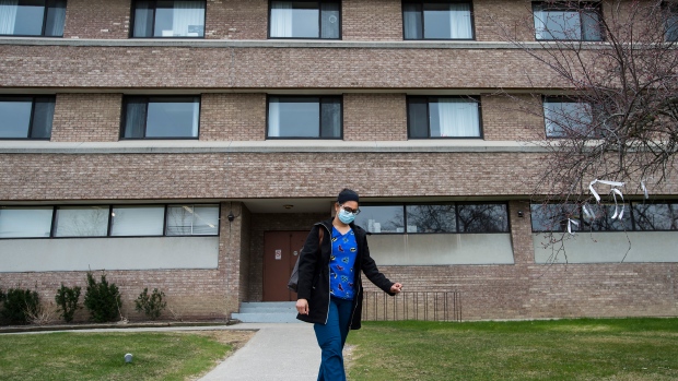 FILE - A healthcare worker leaves after finishing her shift for the day at the Eatonville Care Centre in Toronto on Friday, April 24, 2020. THE CANADIAN PRESS/Nathan Denette 