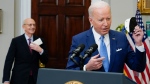 President Joe Biden removes his face mask to speak after Supreme Court Associate Justice Stephen Breyer announced his retirement in the Roosevelt Room of the White House in Washington, Thursday, Jan. 27, 2022. (AP Photo/Andrew Harnik)