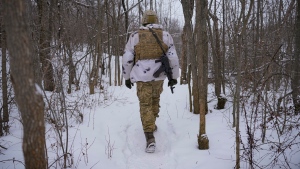 An Ukrainian serviceman heads to an advanced position on the front line in the Luhansk area, eastern Ukraine, Thursday, Jan. 27, 2022. The U.S. rejection of Russia's main demands to resolve the crisis over Ukraine left "little ground for optimism," the Kremlin said Thursday, but added that dialogue was still possible. (AP Photo/Vadim Ghirda)