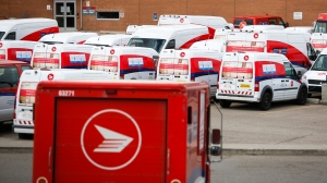 FILE - Delivery vehicles are seen at Canada Post's main plant in Calgary, Alta., Saturday, May 9, 2020, amid a worldwide COVID-19 pandemic. THE CANADIAN PRESS/Jeff McIntosh 