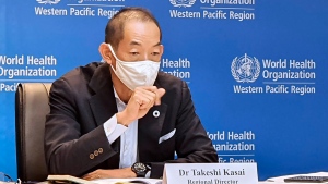 In this handout photo provided by the World Health Organization Regional Office for the Western Pacific, WHO Regional Director for the Western Pacific Dr. Takeshi Kasai, speaks in Manila, Philippines on Thursday, Nov. 11, 2021. World Health Organization officials in the Western Pacific  Friday, Dec. 3, 2021, say border closures adopted by some countries may buy time to deal with the omicron coronavirus variant, but measures put in place and experience gained in dealing with the delta variant should remain the foundation for fighting the pandemic. (World Health Organization via AP)