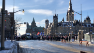 Police closed Wellington Street between Metcalfe and Elgin streets Friday afternoon as 'Freedom Convoy' protesters began to gather on Parliament Hill. (Nate Vandermeer/CTV News Ottawa)