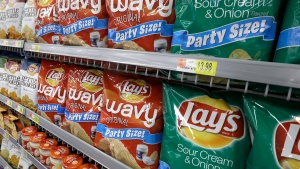 In this Thursday, June 4, 2015, file photo, Lay's products, a PepsiCo brand, are displayed at a Wal-Mart Neighborhood Market in Bentonville, Ark. (AP Photo/Danny Johnston) 