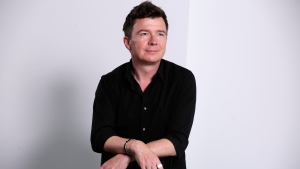 FILE - Singer Rick Astley poses for photos in New York on Aug. 9, 2016. It's been 35 years since Astley's debut album, 'Whenever You Need Somebody,' and BMG is marking the anniversary in May with a two-CD set and digital release that boasts the remastered original album plus B-sides, remixes and Astley's own reimagined versions of the album's original singles. (AP Photo/Richard Drew, File)