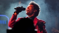 FILE - The Weeknd performs during the halftime show of the NFL Super Bowl 55 football game on Feb. 7, 2021, in Tampa, Fla. The Weeknd was snubbed by the Grammys but he’s the leading nominee at the 2021 Billboard Music Awards. (AP Photo/David J. Phillip, File) 