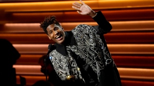 Jon Batiste accepts the award for album of the year for "We Are" at the 64th Annual Grammy Awards on Sunday, April 3, 2022, in Las Vegas. (AP Photo/Chris Pizzello) 
