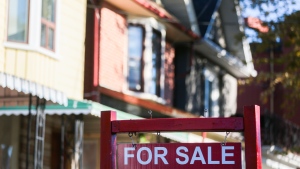 A for sale sign is displayed in front of a house in the Riverdale area of Toronto on Wednesday, September 29, 2021. THE CANADIAN PRESS/Evan Buhler 