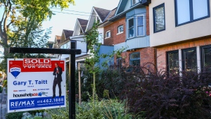 A sold sign is displayed in front of a house in the Riverdale area of Toronto on Wednesday, September 29, 2021. THE CANADIAN PRESS/Evan Buhler 