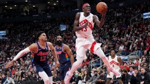 Toronto Raptors forward Pascal Siakam (43) soars to the hoop past Philadelphia 76ers forward Tobias Harris (12) during first half NBA first round playoff action in Toronto, Saturday, April 23, 2022. THE CANADIAN PRESS/Nathan Denette