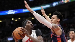 Toronto Raptors forward Chris Boucher (25) looks for the shot under pressure from Philadelphia 76ers forward Danny Green (14) during first half NBA East Division 1st round game 6 basketball action in Toronto, Thursday, April 28, 2022. THE CANADIAN PRESS/Frank Gunn