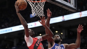 Toronto Raptors forward Chris Boucher (25) looks for the shot under pressure from Philadelphia 76ers forward Danny Green (14) during first half NBA East Division 1st round game 6 basketball action in Toronto, Thursday, April 28, 2022. THE CANADIAN PRESS/Frank Gunn
