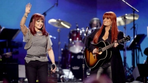 FILE - Naomi Judd, left, and Wynonna Judd, of The Judds, perform at the "Girls' Night Out: Superstar Women of Country," in Las Vegas, April 4, 2011. Naomi Judd, the Kentucky-born matriarch of the Grammy-winning duo The Judds and mother of Wynonna and Ashley Judd, has died, her family announced Saturday, April 30, 2022. She was 76. (AP Photo/Julie Jacobson, File)