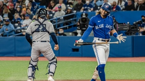 Toronto Blue Jays shortstop Bo Bichette (11) reacts after striking out during the first inning of MLB action against the New York Yankees in Toronto on Monday, May 2, 2022. THE CANADIAN PRESS/Christopher Katsarov