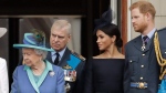 Queen Elizabeth II, Prince Andrew, Meghan the Duchess of Sussex and Prince Harry stand on a balcony at Buckingham Palace in London, on July 10, 2018. (Matt Dunham / AP) 