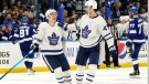 Toronto Maple Leafs right wing Ilya Mikheyev (65) celebrates with left wing Pierre Engvall (47) after his second goal against the Tampa Bay Lightning during the third period in Game 3 of an NHL hockey first-round playoff series Friday, May 6, 2022, in Tampa, Fla. (AP Photo/Chris O'Meara)