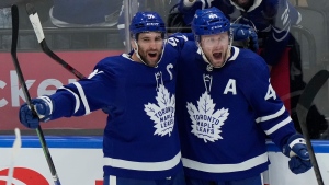 Toronto Maple Leafs defenceman Morgan Rielly (44) celebrates his goal against the Tampa Bay Lightning goaltender Andrei Vasilevskiy with teammate John Tavares (91) during third period NHL first-round playoff series action in Toronto on Tuesday, May 10, 2022. THE CANADIAN PRESS/Frank Gunn