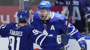 Toronto Maple Leafs defenceman Morgan Rielly (44) celebrates his goal against the Tampa Bay Lightning with teammate John Tavares (91) during third period NHL first-round playoff series action in Toronto on Tuesday, May 10, 2022. THE CANADIAN PRESS/Frank Gunn