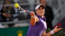 Bianca Andreescu returns the ball to Emma Raducanu during their match at the Italian Open tennis tournament, in Rome, Tuesday, May 10, 2022. (AP Photo/Andrew Medichini) 