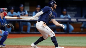 Tampa Bay Rays' Brandon Lowe hits an RBI-triple during the eighth inning of a baseball game against the Toronto Blue Jays, Friday, May 13, 2022, in St. Petersburg, Fla. (AP Photo/Scott Audette)