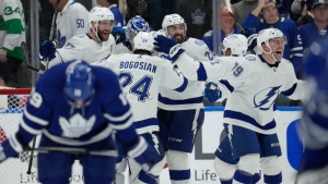 Tampa Bay Lightning players celebrate defeating the Toronto Maple Leafs after NHL first-round playoff series action in Toronto on Saturday, May 14, 2022. THE CANADIAN PRESS/Frank Gunn