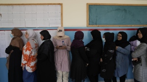 People line up to vote uring parliamentary elections in Beirut, Lebanon Sunday, April 15, 2022. (AP Photo/Hassan Ammar)
