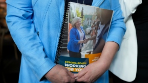 Ontario NDP leader Andrea Horwath holds her platform book after delivering her Ontario provincial election campaign platform in Toronto on Monday, April 25, 2022. THE CANADIAN PRESS/Nathan Denettel 