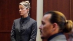 Actor Johnny Depp walks into the courtroom after a break at the Fairfax County Circuit Courthouse in Fairfax, Va., Monday, May 16, 2022. Depp sued his ex-wife Amber Heard for libel in Fairfax County Circuit Court after she wrote an op-ed piece in The Washington Post in 2018 referring to herself as a "public figure representing domestic abuse." (AP Photo/Steve Helber, Pool)