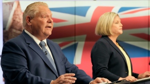 Ontario PC Party Leader Doug Ford speaks as Ontario NDP Leader Andrea Horwath looks on during the Ontario party leaders' debate, in Toronto, Monday, May 16, 2022. THE CANADIAN PRESS/Frank Gunn