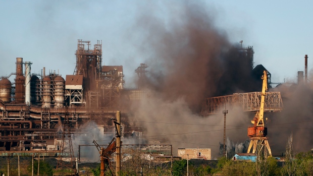 Smoke rises from the Metallurgical Combine Azovstal in Mariupol during shelling, in Mariupol, in territory under the government of the Donetsk People's Republic, eastern Ukraine, Saturday, May 7, 2022. (AP Photo/Alexei Alexandrov)